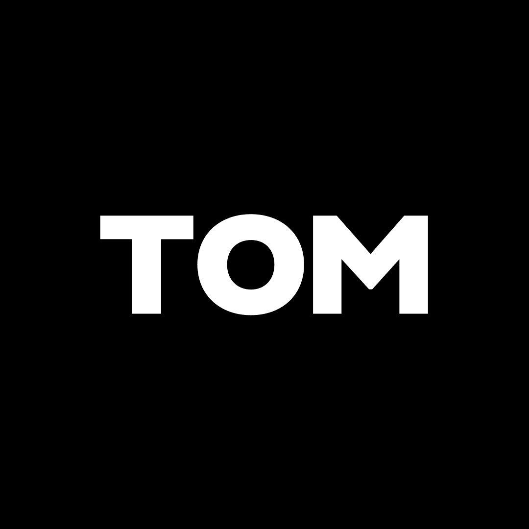 TOM wordmark — black and white